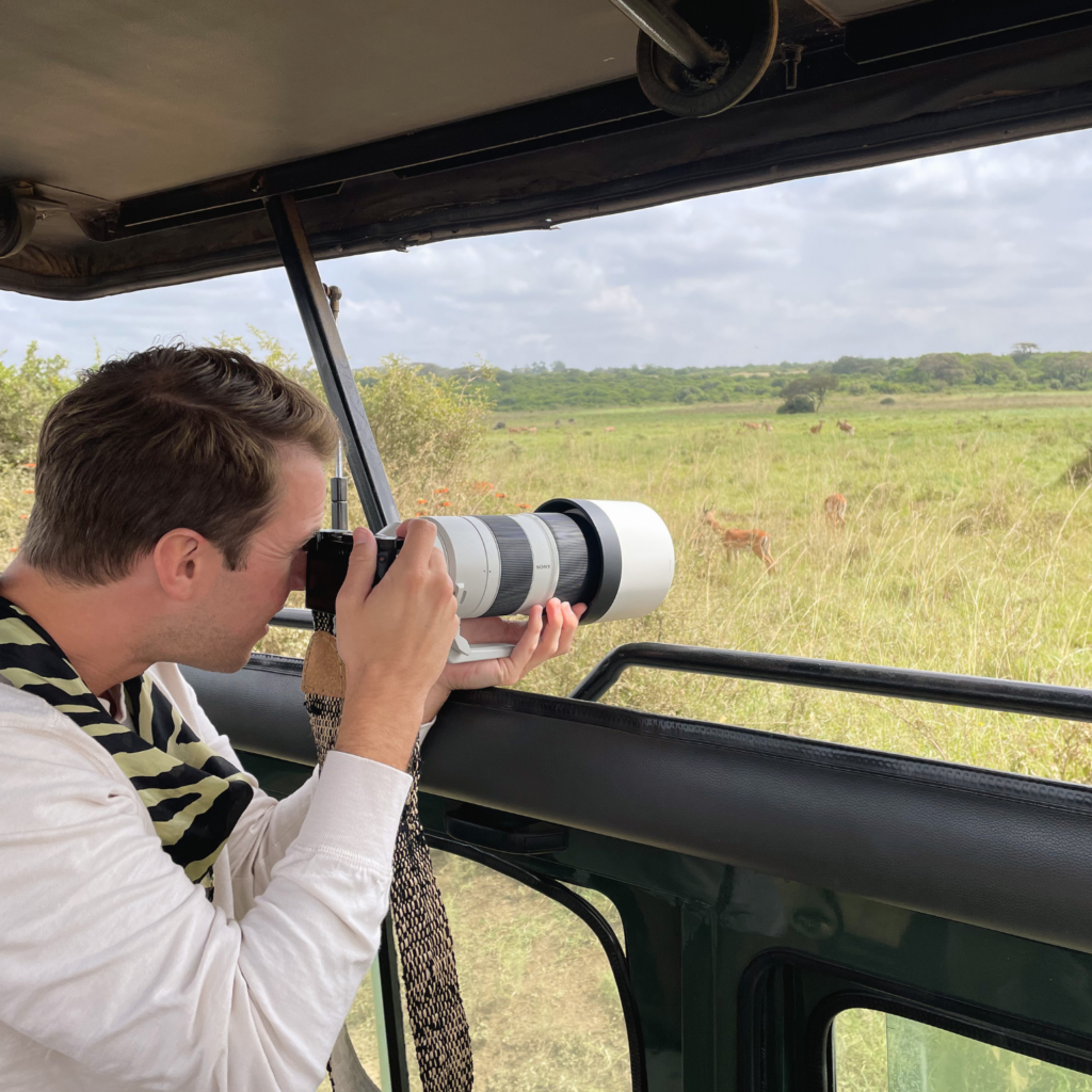 man photographing impala Nairobi National Park