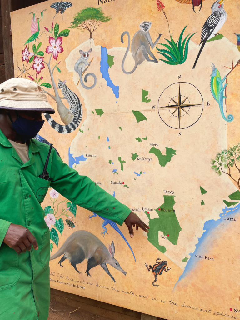 Sheldrick Wildlife Trust caretaker with map of Kenya