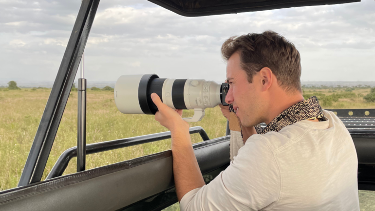 man photographing wildlife on safari